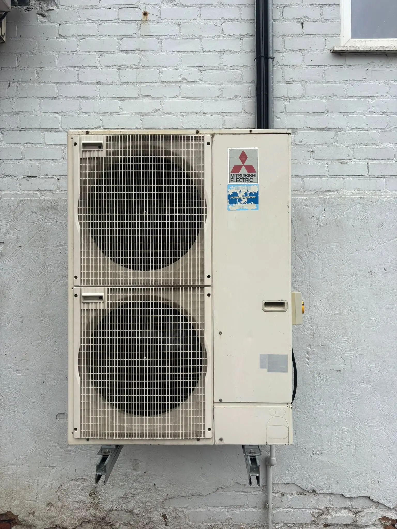 Twin-fan outdoor air conditioning unit after cleaning